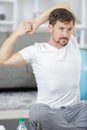 handsome man doing yoga on bed Royalty Free Stock Photo