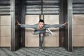 Handsome man doing yoga on urban background Royalty Free Stock Photo