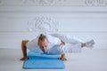 Handsome man doing yoga pose  on a white background Royalty Free Stock Photo