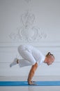 Handsome man doing yoga pose  on a white background Royalty Free Stock Photo