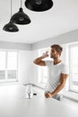 Handsome Man Drinking Glass Of Fresh Water Indoors In Morning Royalty Free Stock Photo