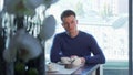 Handsome man drinking tea, waiting for someone at the restaurant Royalty Free Stock Photo