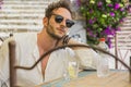 Handsome man drinking water at table outdoor Royalty Free Stock Photo