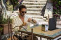 Handsome man drinking water at table outdoor Royalty Free Stock Photo