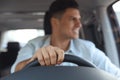 Handsome man driving his car, focus on hand Royalty Free Stock Photo