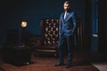 Handsome Man In Elegant Suit In Luxury Interior. Closeup Portrait Of Fashionable Confident Man In Luxurious Apartment. Royalty Free Stock Photo