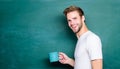 Handsome man enjoy hot coffee. Coffee addicted. Inspiring drink. Dose of caffeine. Teacher drink coffee chalkboard Royalty Free Stock Photo