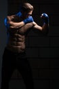 Handsome Man Exercising Bag Boxing In Studio Royalty Free Stock Photo