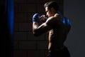 Handsome Man Exercising Bag Boxing In Studio Royalty Free Stock Photo