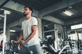 Handsome Man is Exercising With Bodybuilder Pulling Machine in Fitness Club.,Portrait of Strong Sport Man Doing Working Out Muscle