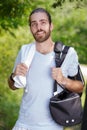 handsome man exercising in forest