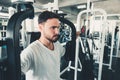 Handsome Man is Exercising With Pectoral Machine in Fitness Club.,Portrait of Strong Man Doing Working Out Calories Burning in Gym Royalty Free Stock Photo