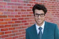 Handsome man face with a white perfect smile with a red background wearing glasses or bifocals