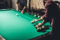 handsome man forming triangle of russian pool balls