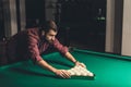 handsome man forming triangle of russian pool balls