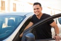 Handsome man getting into his car Royalty Free Stock Photo