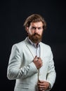 Handsome man on gray background. serious bearded businessman. stylish mature man looking modern. mens office wardrobe