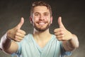 Handsome man guy giving thumb up gesture. Royalty Free Stock Photo