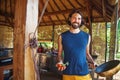 Handsome man with handful of freshly picked tomatoes