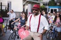 Handsome man with a hat and heart on the bicycle and fancy stuff in Izmir and on the day of Fancy Woman bike tour festival