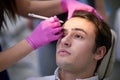 Handsome man having a wrinkle treatment