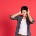 Handsome man in headphone listening music outdoors Royalty Free Stock Photo