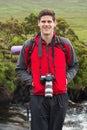 Handsome man on a hike with camera around his neck Royalty Free Stock Photo