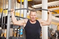 Handsome man in his forties exercising in gym Royalty Free Stock Photo