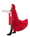 Handsome man in historical pirate costume and cloak holding something isolated