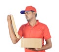 Handsome man holding carton box with anger