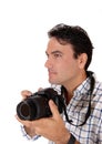 A handsome man holding his camera ready for a shoot Royalty Free Stock Photo