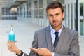 Handsome man holding a magical potion Royalty Free Stock Photo