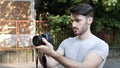 Young man posing with photo camera Royalty Free Stock Photo