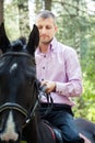 Handsome man on horse Royalty Free Stock Photo