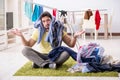 The handsome man husband doing laundering at home Royalty Free Stock Photo