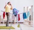 Handsome man husband doing laundering at home Royalty Free Stock Photo