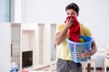 The handsome man husband doing laundering at home Royalty Free Stock Photo