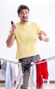 Handsome man husband doing laundering at home Royalty Free Stock Photo