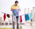 Handsome man husband doing laundering at home Royalty Free Stock Photo