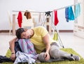 Handsome man husband doing laundering at home Royalty Free Stock Photo