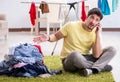 Handsome man husband doing laundering at home Royalty Free Stock Photo