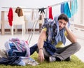 Handsome man husband doing laundering at home Royalty Free Stock Photo