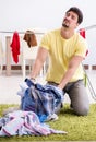 Handsome man husband doing laundering at home Royalty Free Stock Photo