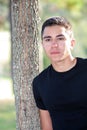 Handsome Man Leaning on a Tree Royalty Free Stock Photo