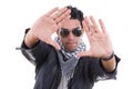 Handsome man in leather jacket with sunglasses wearing scarf Royalty Free Stock Photo