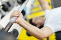 Handsome man lifting weights in gym Royalty Free Stock Photo