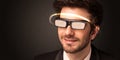 Handsome man looking with futuristic high tech glasses Royalty Free Stock Photo