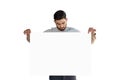 Handsome man looking at white blank sheet Royalty Free Stock Photo