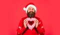 Handsome man love winter holidays red background. Merry christmas and happy new year. Let me Melt Your Heart. Welcome