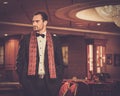Handsome man in luxury casino interior Royalty Free Stock Photo